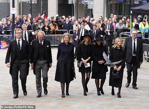 Mourners arrive for the Duchess of Kent's funeral service at Westminster Cathedral today