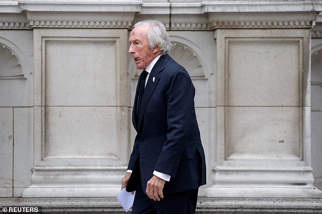 Former Formula One racing driver Jackie Stewart arrives at Westminster Cathedral today