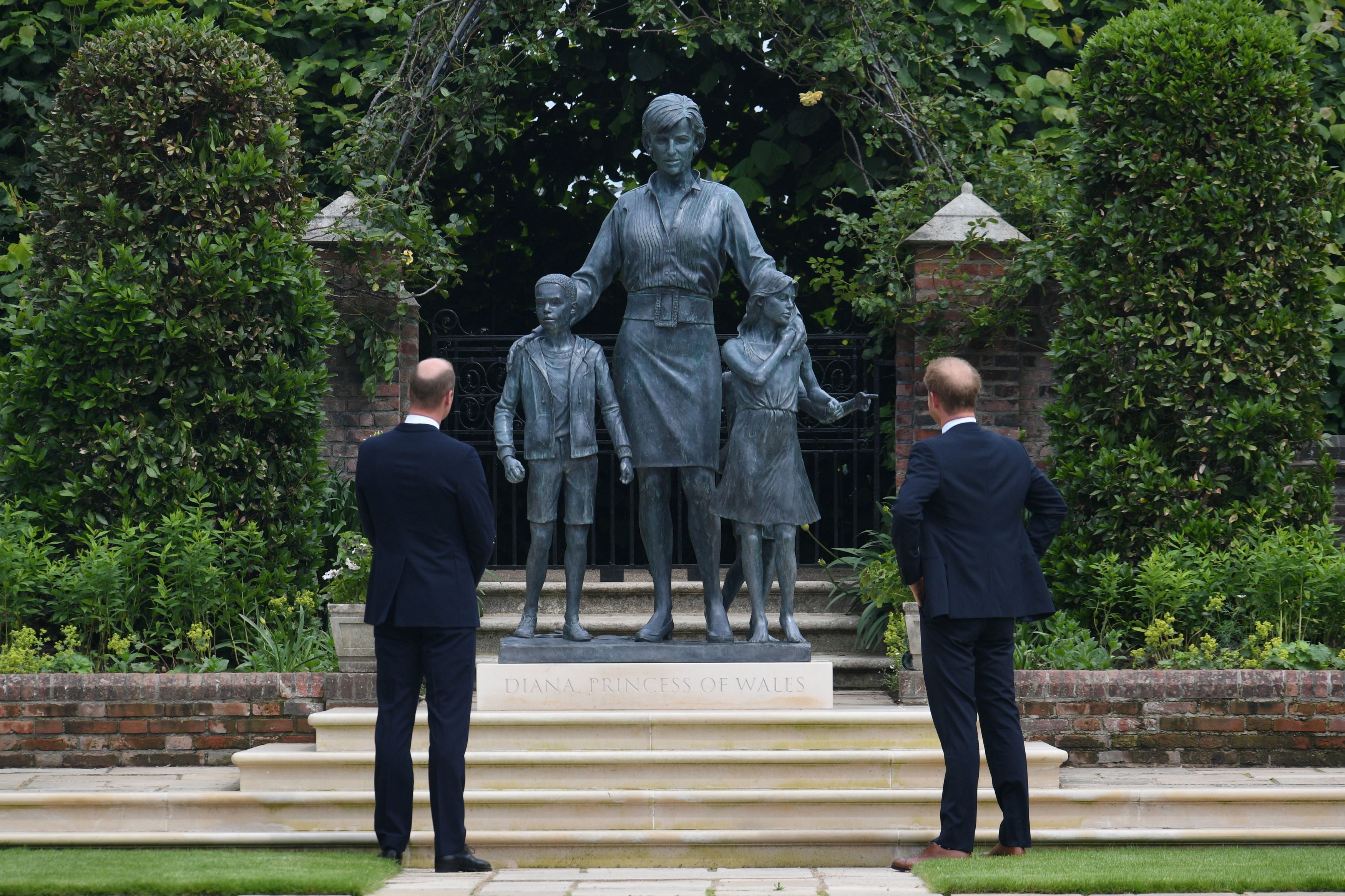 Britain's William and Harry put feud aside to unveil Princess Diana statue  | Reuters