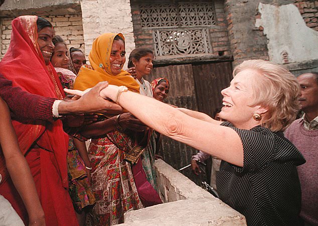 The Duchess of Kent meets women in India during a visit to mark 50 years of Unicef in 1996