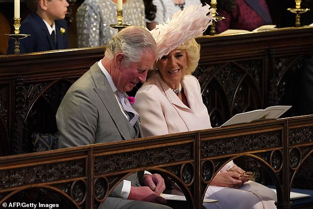 Charles and Camilla are pictured during the Sussexes's wedding