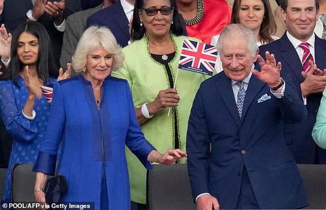 The King and Queen danced along to Take That's performance of Shine as George and Charlotte waved their Union flags