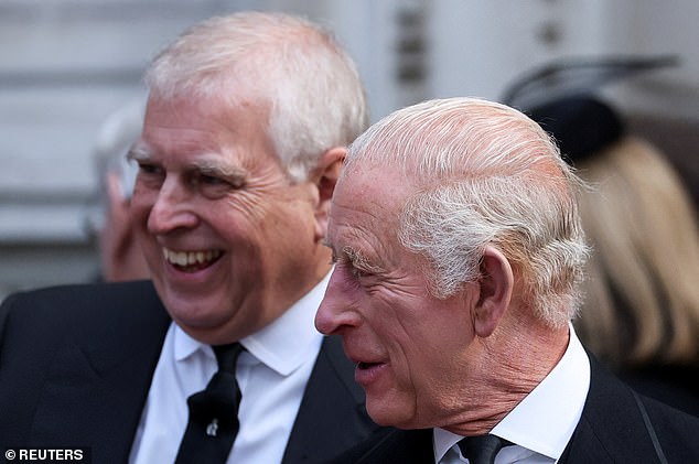 Prince Andrew laughs as he stands next to his brother King Charles III as they leave Westminster Cathedral