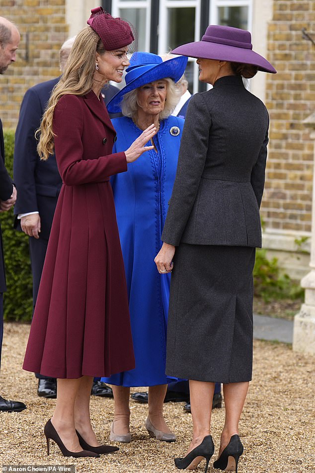 Third wheeling? The Princess of Wales (left) is seen animatedly chatting to First Lady Melania Trump (right) as Queen Camilla (centre) looks on at Windsor Castle today