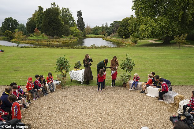 For one activity, the Squirrel Scouts along with their leaders formed a circle with Kate and Melania