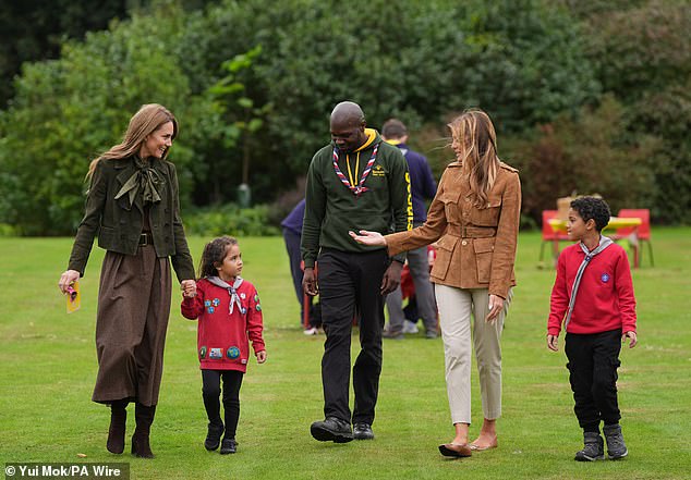 The Princess of Wales and the First Lady were joined by two of the Squirrel Scouts as they talked to one of the scout leaders