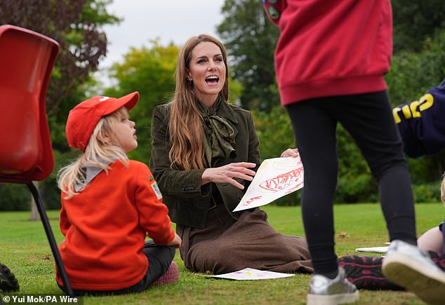 She animatedly showed her picture to the young children, who appeared equally excited to see her