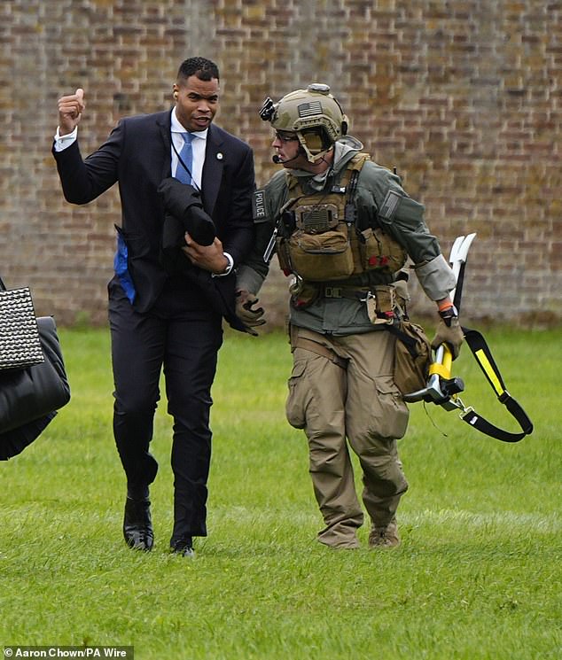 White House staff (left) disembarking from helicopter before Donald and Melania Trump touched down at Windsor