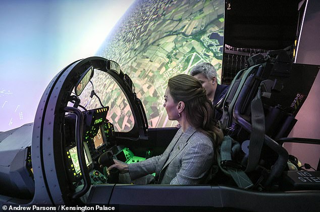 At one point, Kate, 43, performed a virtual 'loop the loop' manoeuvre on a flight simulator during her visit to the Lincolnshire base