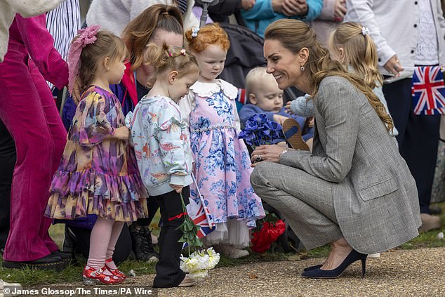 The princess looked in her element as she chatted with young children, who brought her gifts of flowers