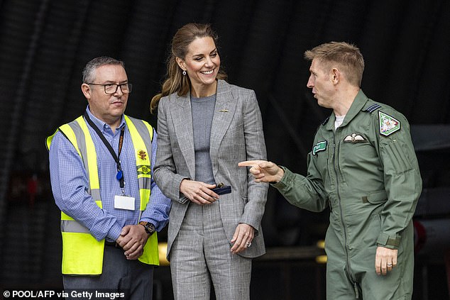 Catherine, Princess of Wales smiles as she speaks to military personnel during a visit to RAF Coningsby