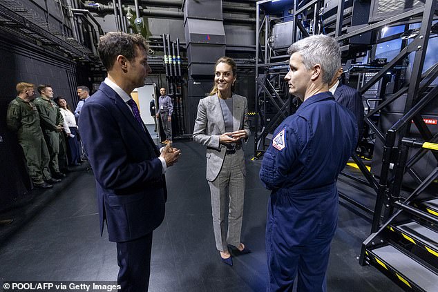 Britain's Catherine, Princess of Wales smiles are she meets military personnel during a visit to RAF Coningsby in Lincolnshire