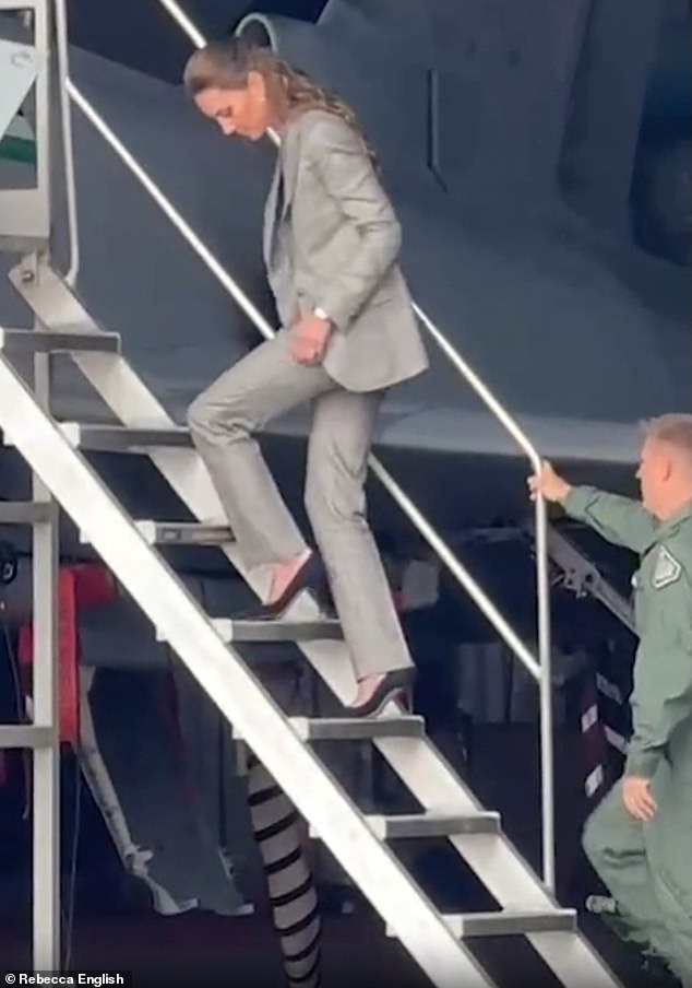 Kate amazed fans with her ability to flawlessly strut up and down an aircraft's boarding stairs in her navy stilettos from Stuart Weitzman