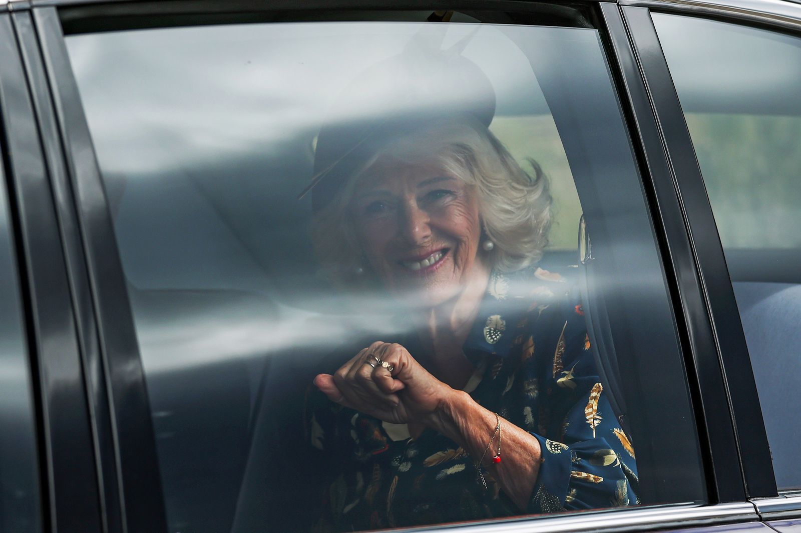 Image may contain Marilyn Bowering Person Adult Face Head Car Transportation Vehicle Clothing Hat and Accessories