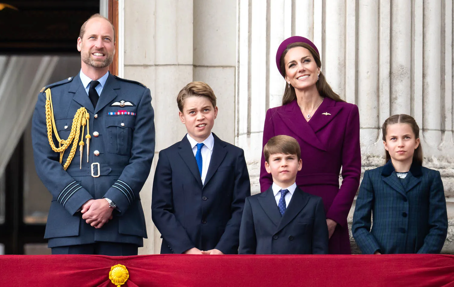 Prince William, Prince of Wales, Prince George, Catherine, Princess of Wales, Prince Louis and Princess Charlotte watch the flypast to mark the 80th anniversary of VE Day on May 05, 2025 in London, England.