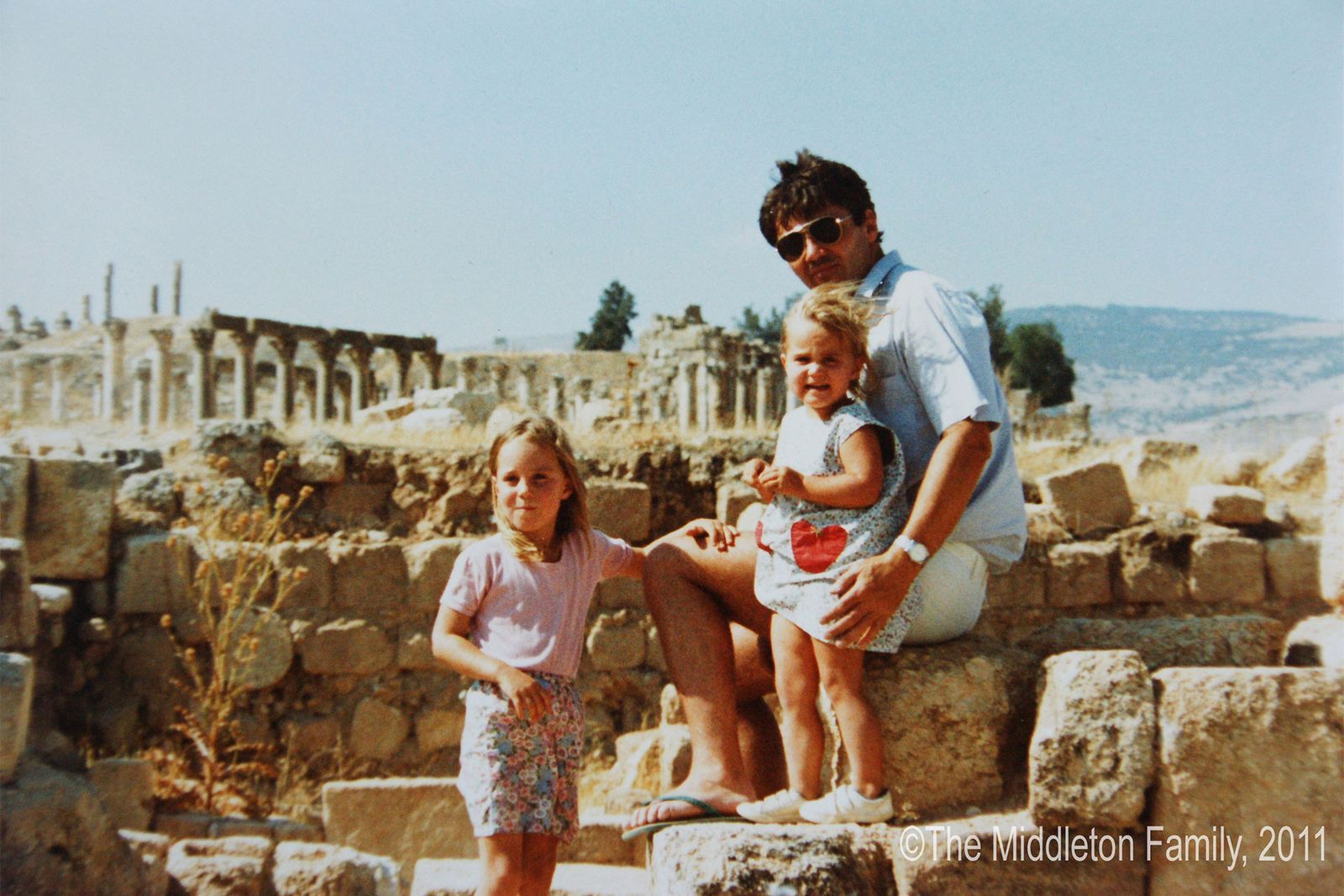 Image may contain Sunglasses Accessories Accessory Shorts Clothing Apparel Human Person Vacation and Tourist