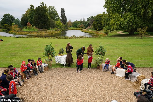 For one activity, the Squirrel Scouts along with their leaders formed a circle with Kate and Melania