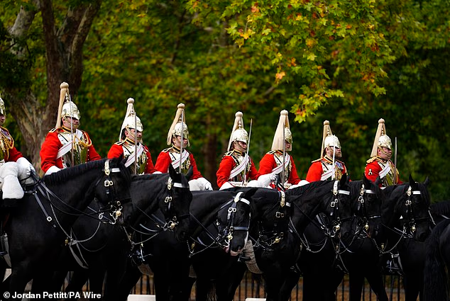 Nine mounted cavalry troopers from the Life Guards formed a detachment on the Wellington Barracks Square for the arrival of the hearse