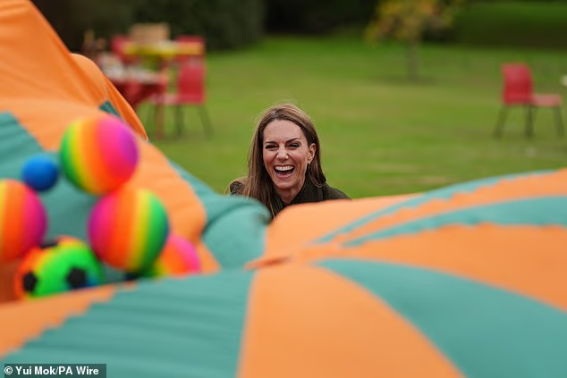 Kate through herself into the children's activities today, laughing as she took part in the games