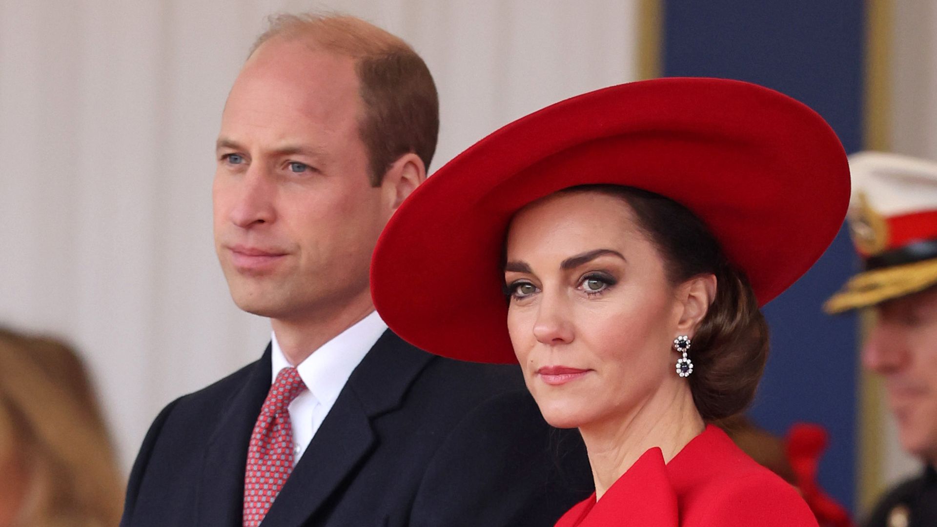 William and Kate in red hat and dress at state visit