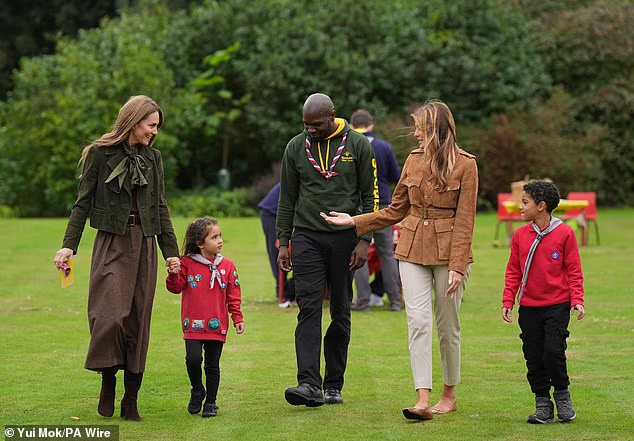 The Princess of Wales and the First Lady were joined by two of the Squirrel Scouts as they talked to one of the scout leaders
