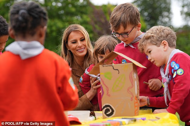 Melania was pictured with the children as they took part in arts and crafts projects