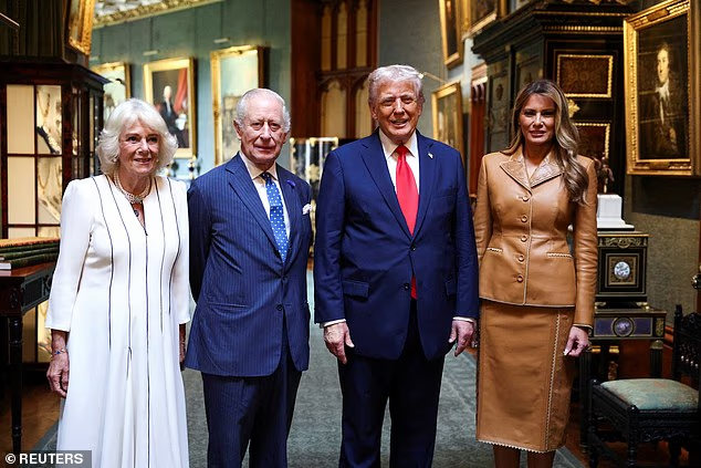 US President Donald Trump and First Lady Melania Trump stand next to King Charles III and Queen Camilla as they bid their farewells while they depart Windsor Castle this morning
