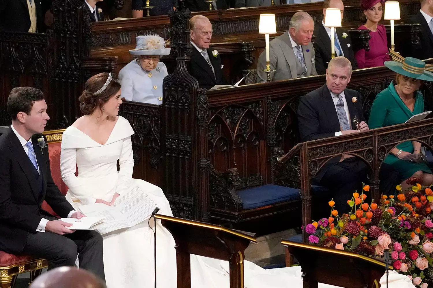 Britain's Queen Elizabeth II (3L), looks on as Britain's Princess Eugenie of York (2L) and Jack Brooksbank (L) look towards her parents Britain's Prince Andrew, Duke of York (2R) and Sarah, Duchess of York, during their wedding ceremony at St George's Chapel, Windsor Castle, in Windsor, on October 12, 2018. 
