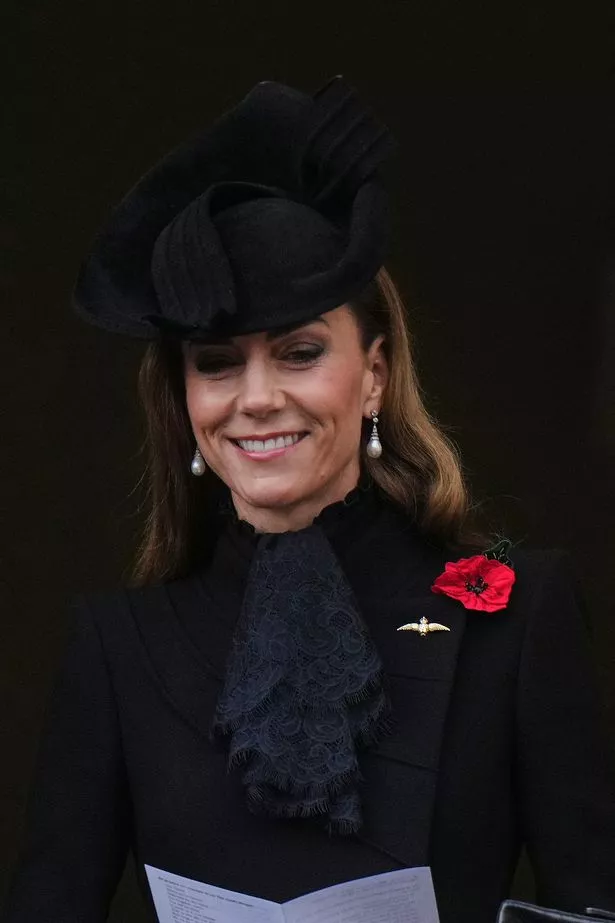 Kate gives a smile at the end of the event 