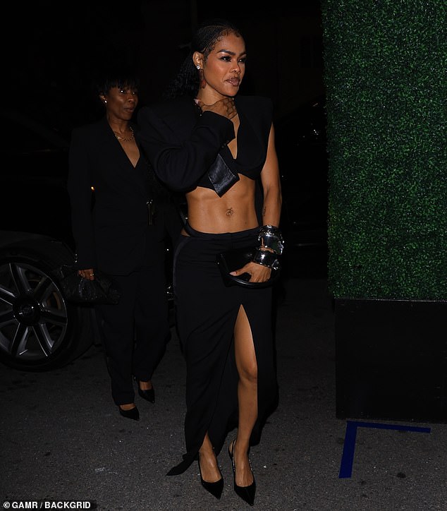Teyana Taylor bared her sculpted midriff in a structured black drop top that matched her tantalizingly high-cut skirt and towering stilettos