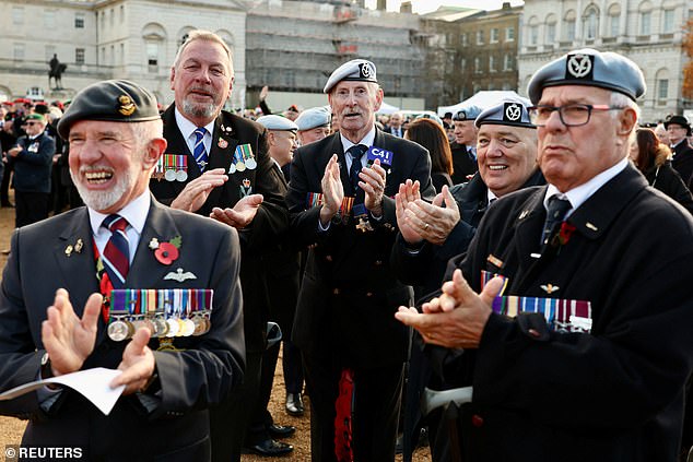 Veterans applaud as Chelsea Pensioners arrive on Horse Guards Parade