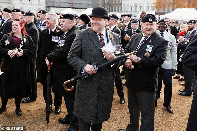 Veterans watch as Chelsea Pensioners arrive on Horse Guards Parade