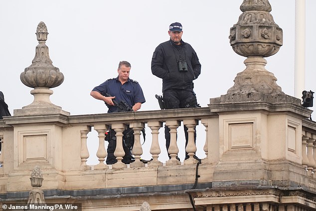 Police marksmen watch over Whitehall ahead of the Remembrance Sunday service