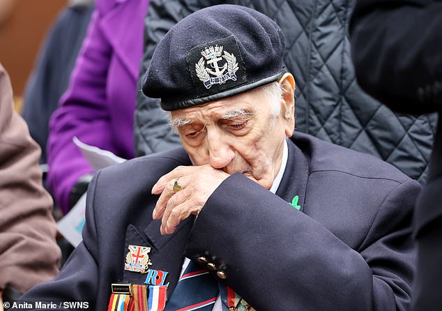 A veteran appears emotional at Armistice Day in Bedworth, Warwickshire