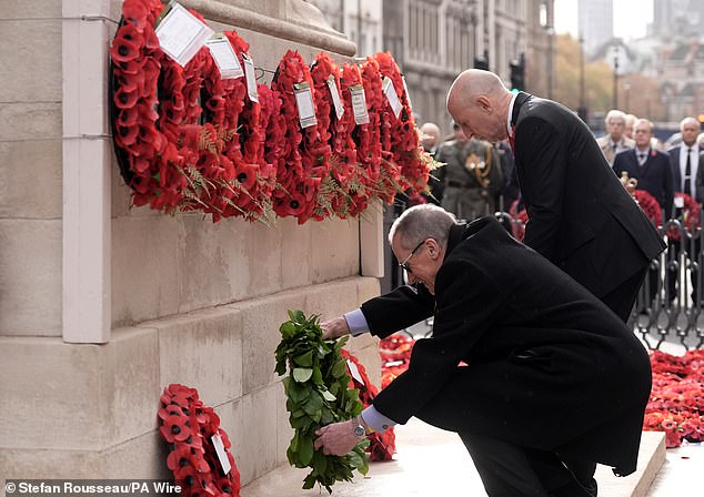 Defence Secretary John Healey (right) and Charles Garrett lay wreaths of poppies during the Western Front Association's Armistice Day ceremony