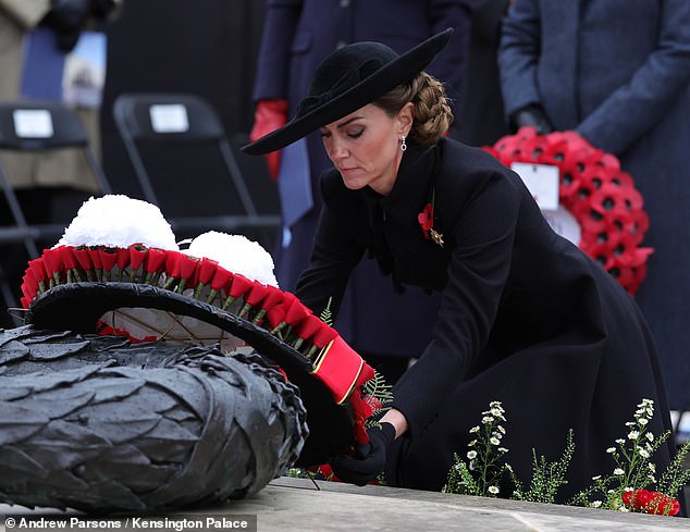 Catherine lays a wreath at the Armed Forces Memorial today, which features a handwritten note