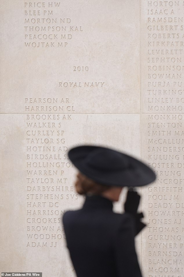 The Princess of Wales stands back to view names inscribed on the memorial wall