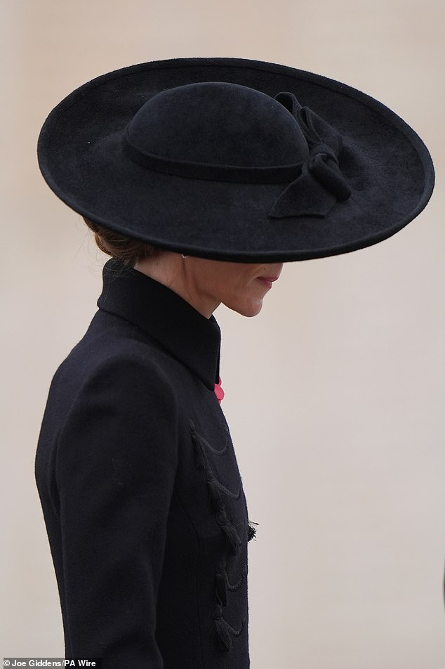 The Princess wears a large hat to match her military-style coat and black boots