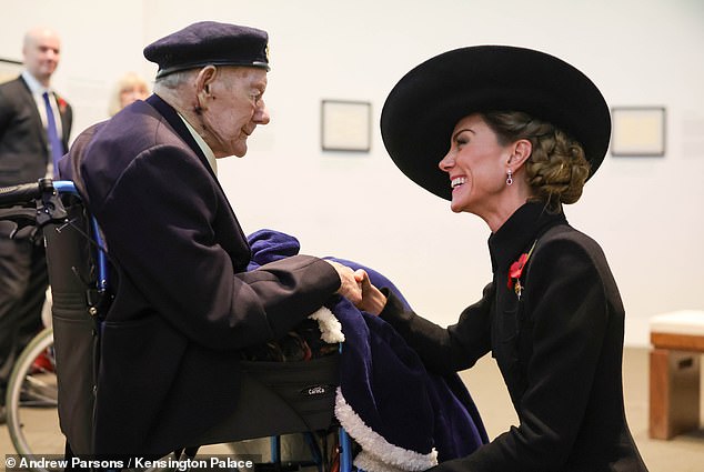Princess Catherine speaks with veterans after the Armistice Day service at the National Memorial Arboretum