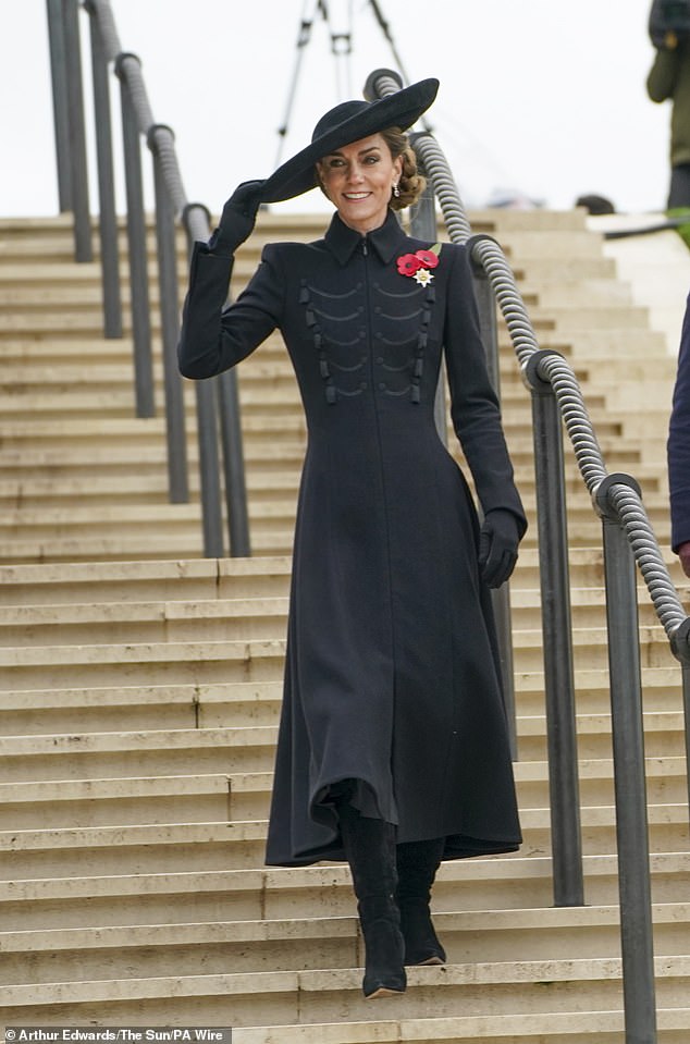 The Princess of Wales smiles as she walks down the stairs after the service to meet veterans