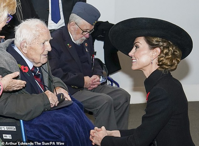 Her Royal Highness kneels before Second World War veteran Geoff Spencer at the National Memorial Arboretum