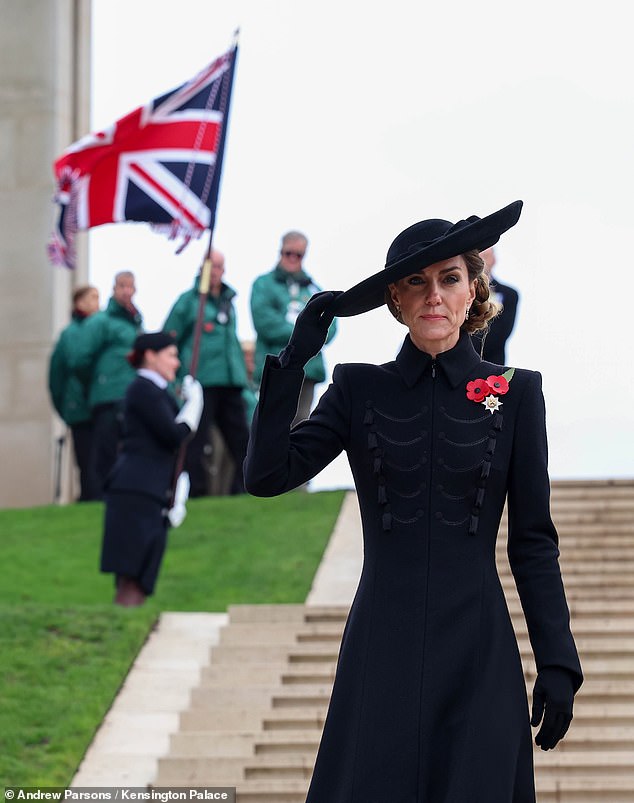 Kate holds onto her hat as she walks around during her visit to the National Memorial Arboretum