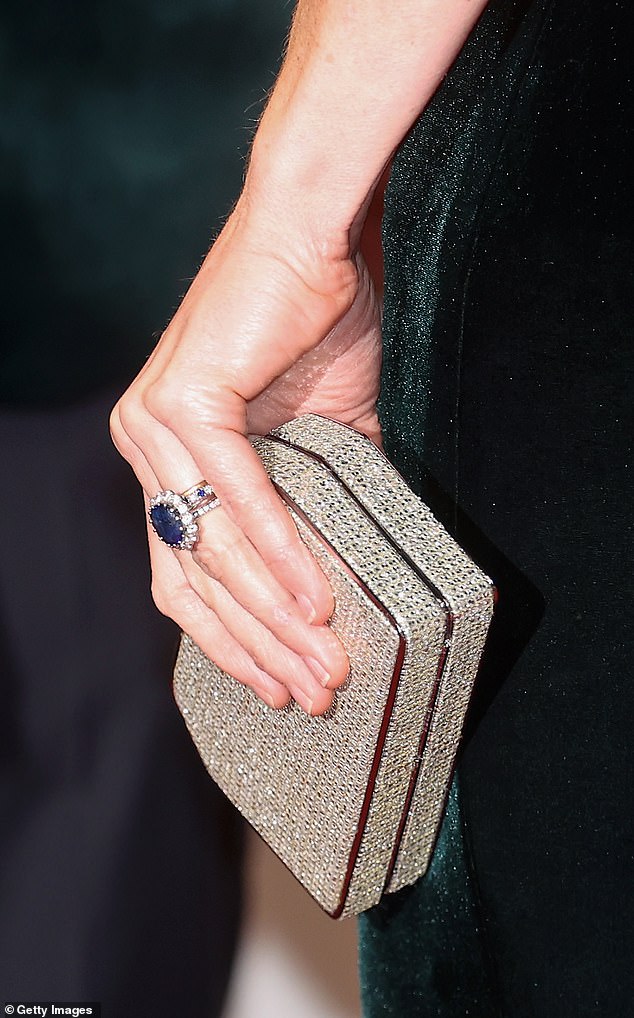 The Princess of Wales was seen wearing multiple rings, including her famous sapphire engagement ring which belonged to Princess Diana