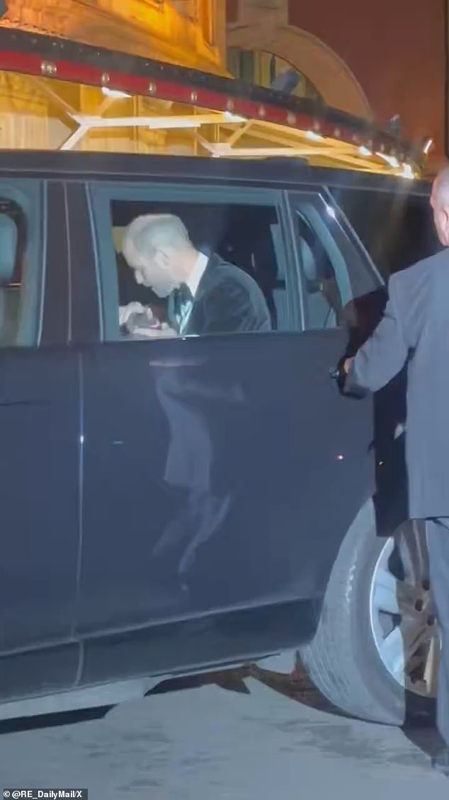 Prince William appeared to take ahold of Kate Middleton's hand and give it an air kiss before they exited the car to enter the Royal Albert Hall in London
