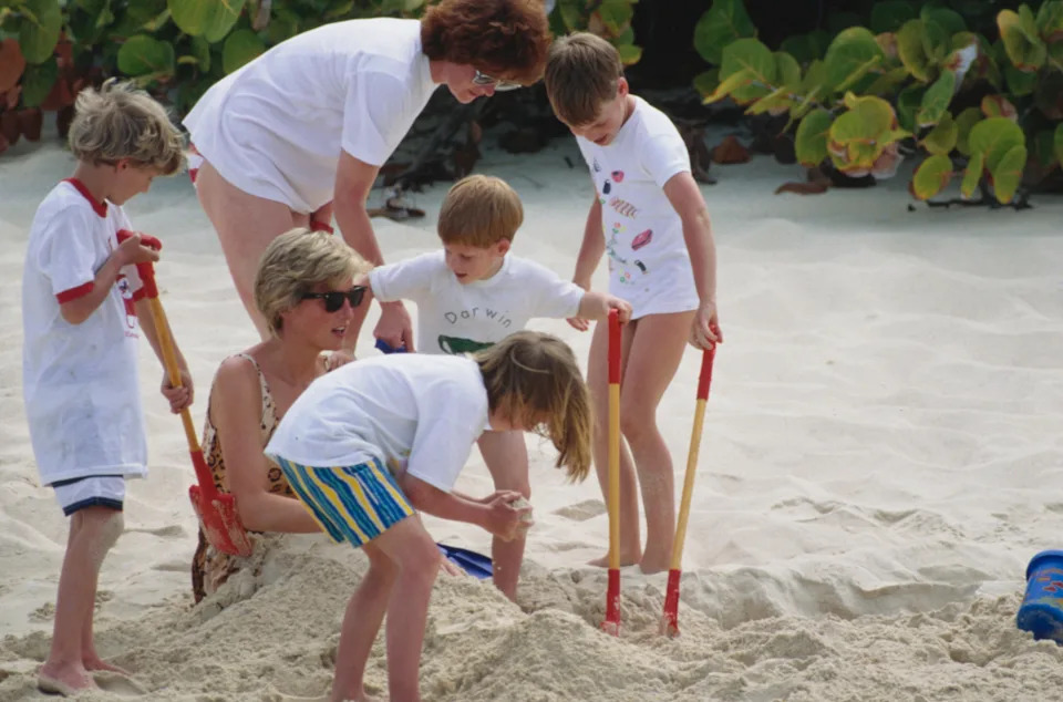 Princess Diana being buried in the sand by Prince William, Prince Harry and her nephews