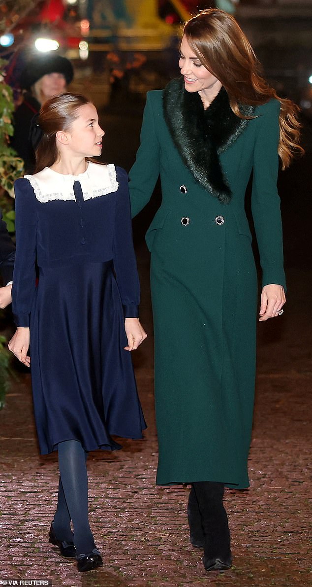The mother-of-three lovingly looked at her daughter ahead of tonight's annual carol service in London