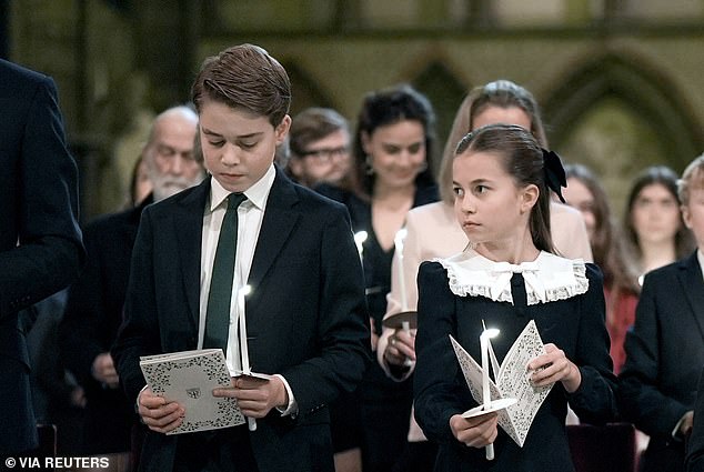 Prince George wore a dark suit with a green tie for his mother's carol concert while Princess Charlotte wore a navy dress with a ruffled white collar