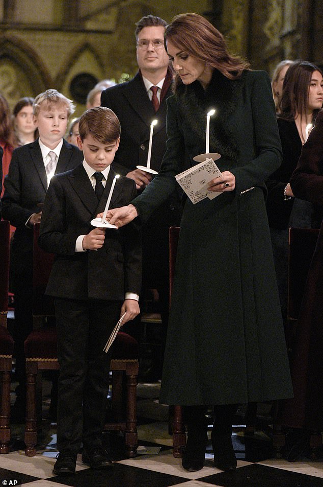 Prince Louis stays close to his mother as Prince George and Princess Charlotte joined their parents at Westminster Abbey for the Christmas carol concert