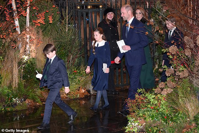 Prince William and Princess Catherine appeared in high spirits, despite the wet weather on Friday evening