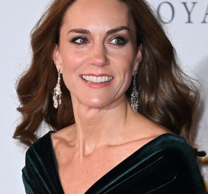 A Royal Rule Was Quietly Broken — and Cameras Caught the Sweetest Moment. It was supposed to be a polished, formal evening — but one small, furry guest completely stole the spotlight. During the Royal Variety Performance, Catherine, Princess of Wales had a moment no one could script. As the Princess moved through the event with her usual poise, she spotted a gentle-natured dog nearby… and couldn’t help herself. She stopped. She smiled. And then she reached down. In a heartwarming clip now melting hearts online, Catherine is seen softly patting the furry guest, completely forgetting the cameras, the protocol, and the royal setting around her. The dog leaned in. The Princess laughed. And just like that, the room relaxed. Royal watchers instantly noticed the shift — this wasn’t a rehearsed interaction or a formal photo op. It was spontaneous, genuine, and unmistakably human. For a brief moment, the future queen wasn’t making headlines for fashion or diplomacy — she was just someone who loves dogs. Fans are calling it: 💬 “The most relatable royal moment in ages” 💬 “This is why people adore her” 💬 “You can’t fake that kind of warmth” Why did this simple interaction resonate so deeply? What did onlookers say about the Princess’s reaction? And why are royal fans convinced this tiny moment reveals something bigger about who Catherine really is behind the scenes?